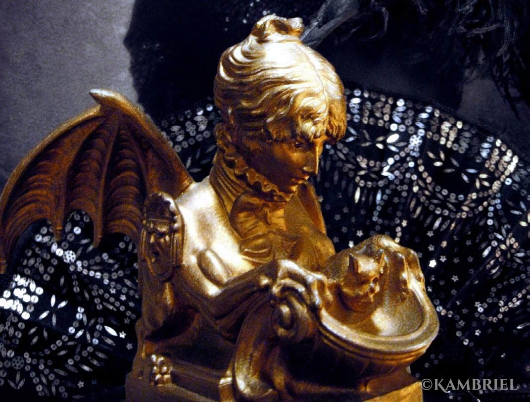 Self-portrait “Sphinx” inkwell sculpted by legendary actress Sarah Bernhardt, circa 1880. The inkwell portion is topped with a horned skull, and she has comedy-tragedy-mask shoulder epaulettes in tribute to her passion for theater, the body of a transformative griffin with scaled tail, fierce claws, and dramatic batwings ready to take flight—all topped off with a high ruffled collar and impeccably tied ribbon bow around her neck.