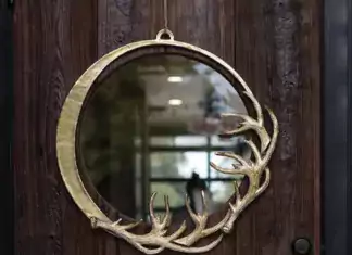 Winter Coziness Unveiled: Curating Your Home for the Season Eric + Eloise Collection Rustic Gold Deer Antler Sculpture Metal Holiday Wreath from Darby Trading